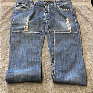 Monica’s distressed size 13 blue jeans